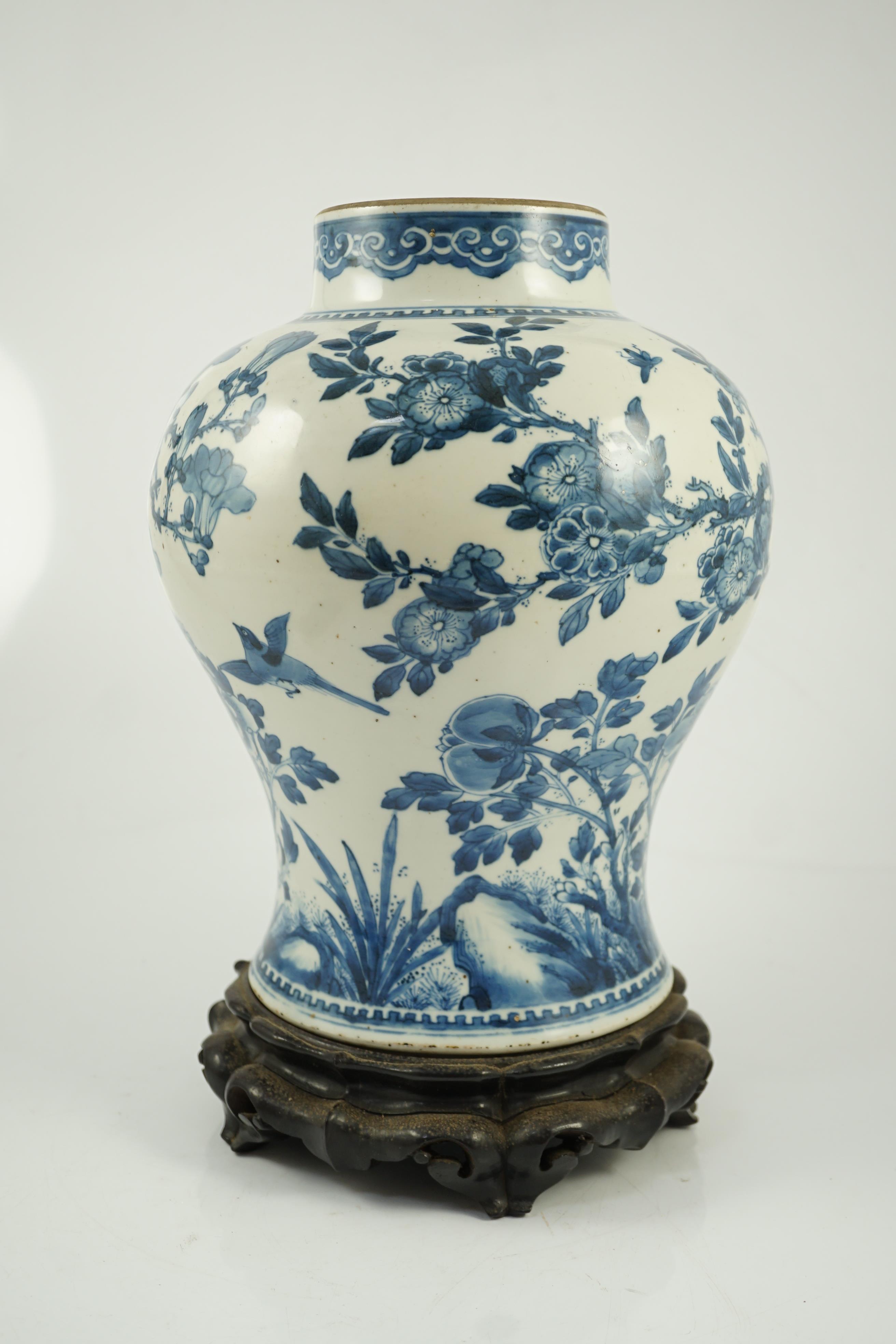 A Chinese blue and white ‘birds and blossom’ baluster vase, Kangxi period